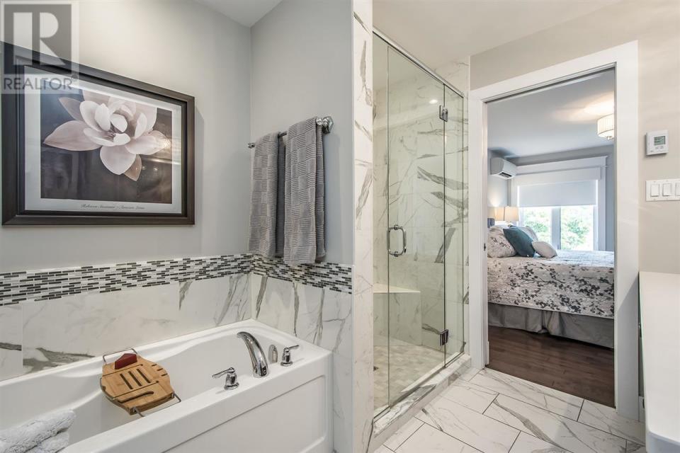 <p><a rel="nofollow noopener" href="https://www.zoocasa.com/bedford-ns-real-estate/5548022-2-shipyard-lane-bedford-ns-b4a2g3-201821360" target="_blank" data-ylk="slk:2 Shipyard Rd., Bedford, N.S.;elm:context_link;itc:0;sec:content-canvas" class="link ">2 Shipyard Rd., Bedford, N.S.</a><br>There are also two-and-a-half bathrooms, including the master ensuite with soaker tub, custom tile and glass shower and heated floors.<br>(Photo: Zoocasa) </p>
