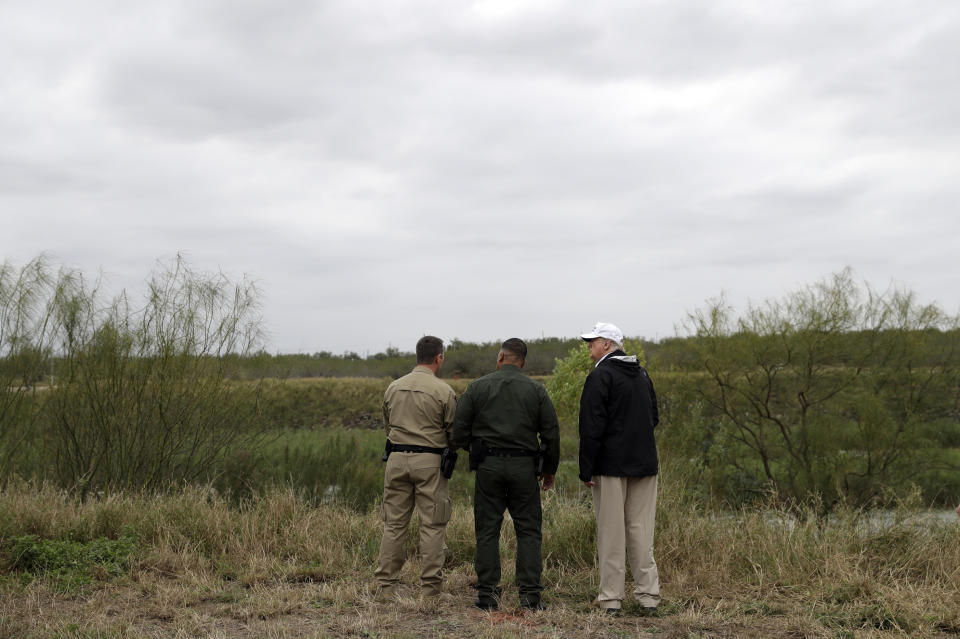 FILE - In this Jan. 10, 2019, file photo President Donald Trump, far right, tours the U.S. border with Mexico at the Rio Grande on the southern border in McAllen, Texas. The Trump administration said Thursday, Feb. 7, 2019, it would waive environmental reviews to replace up to 14 miles (22.5 kilometers) of border barrier in San Diego, shielding itself from potentially crippling delays. San Diego was the third busiest corridor for illegal crossings among the Border Patrol's nine sectors along the Mexican border in 2018 after Texas' Rio Grande Valley and Tucson, Ariz. (AP Photo/Evan Vucci, File)