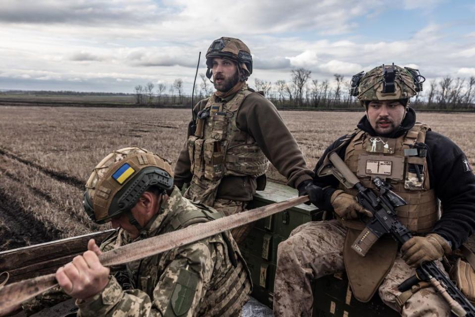 Ukrainian soldiers of the 24th Separate Assault Battalion, also known as the Aidar Battalion, are on a military truck near the frontline in the direction of Bakhmut, Ukraine, on April 22, 2023. (Photo by Diego Herrera Carcedo/Anadolu Agency via Getty Images)