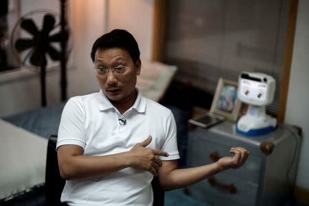 Chalermpon Punnotok, CEO of CT Asia Robotics speaks during an interview with Reuters in Bangkok, Thailand July 5, 2016. REUTERS/Athit Perawongmetha