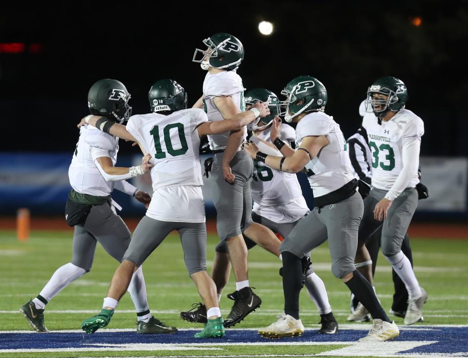 Pleasantville players celebrate after defeating Ravena 15-7 in the Class B state semifinal at Middletown High School on Saturday.