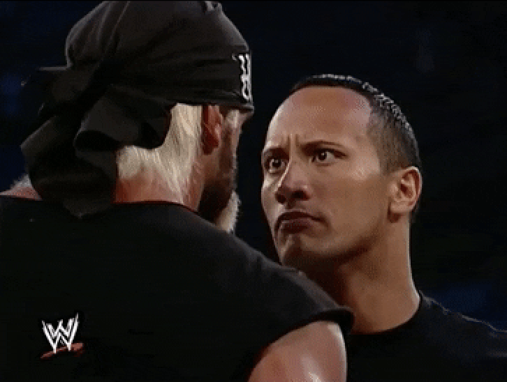 Dwayne "The Rock" Johnson makes direct eye contact with another person.