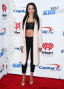 <p>Tinashe will be adorable no matter what, so she kept things simple in a black crop top and ankle-baring skinnies. She added a pale pink coat and matching pumps to her look, the perfect sartorial metaphor for global warming. <i>Photo: Splash</i></p>