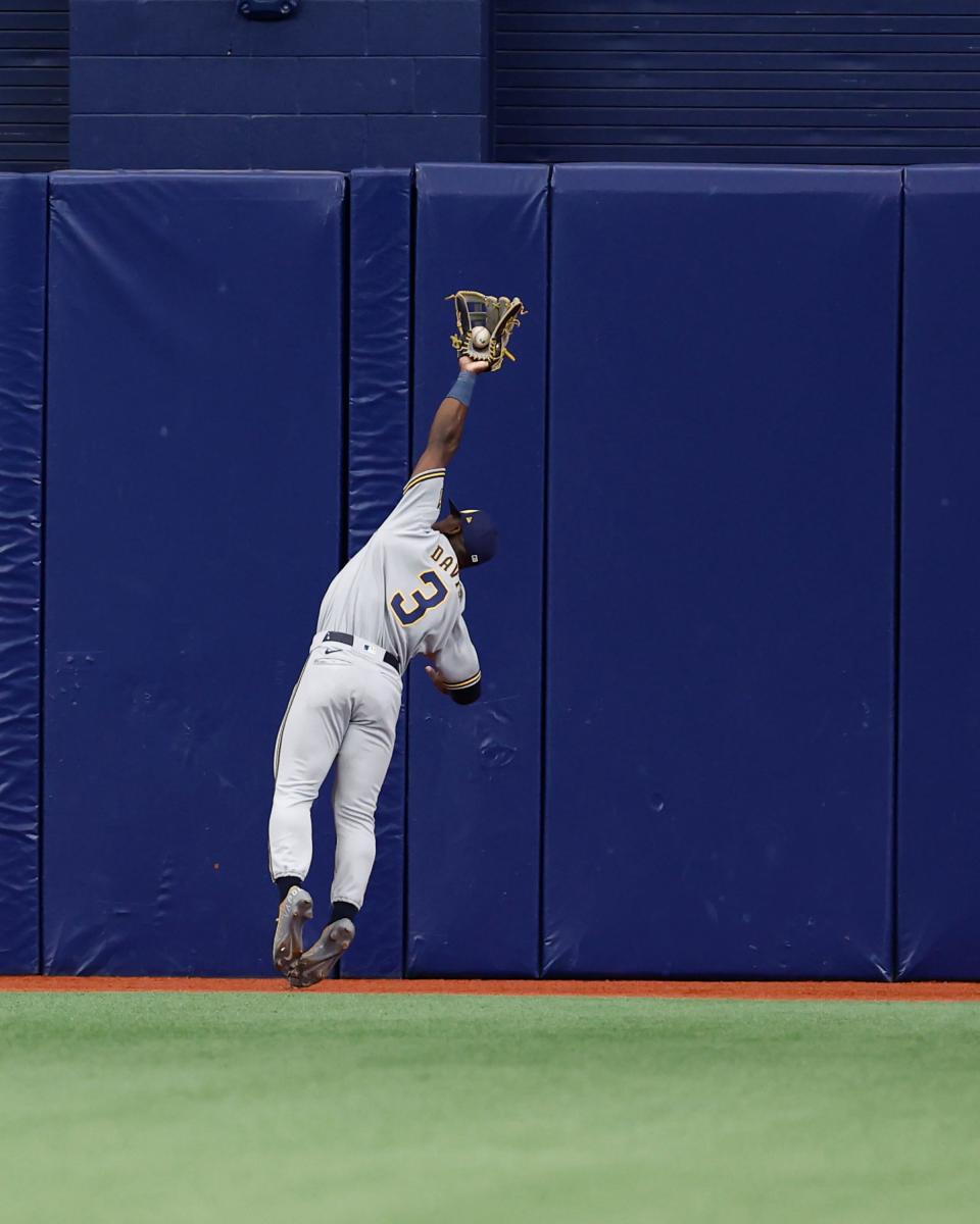 ST PETERSBURG, FLORIDA - JUNE 29: Jonathan Davis #3 of the Milwaukee Brewers makes makes a diving catch off a fly ball from the bat of Randy Arozarena #56 of the Tampa Bay Rays during the second inning at Tropicana Field on June 29, 2022 in St Petersburg, Florida. (Photo by Douglas P. DeFelice/Getty Images)