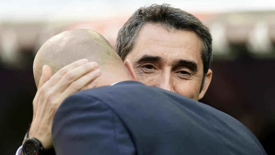 <p>The managers embrace before the game </p>