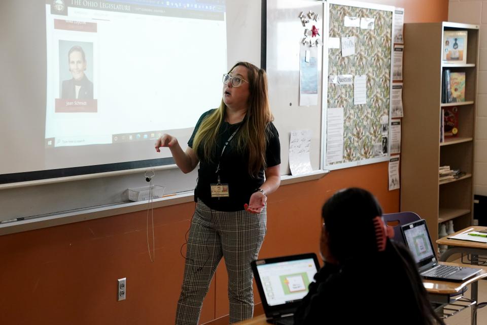 Aiken High School social studies teacher Bethany Cole explains who the sponsors of House Bill 616 are to her 11th-grade class, Monday, April 18, 2022, in Cincinnati, The bill, if passed, would prohibit the teaching of "any divisive or inherently racist" concepts.