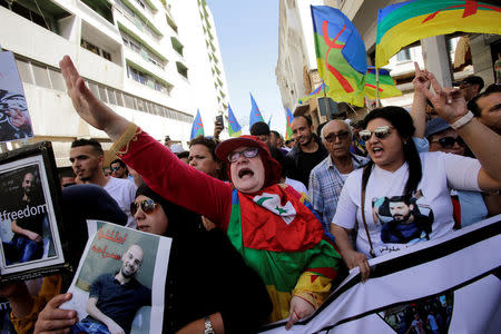 A woman shouts slogans during a demonstration against the Moroccan court after the jailing of Moroccan activist and leader of "Hirak", Nasser Zefzafi, and a number of other activists, in the Moroccan capital of Rabat, Morocco July 15, 2018. REUTERS/Youssef Boudlal