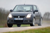 <p>With its smily face and dinky proportions the <strong>Swift Sport </strong>is as cute as a puppy wearing a bow. In fact it is disarmingly sweet to look at, which simply makes its propensity for snap lift-off oversteer all the more alarming.</p><p>This charming little hatchback will have you off the road if you aren’t paying attention. Of course, that pointy handling balance is exactly what makes it so much fun to pedal along. The <strong>1.6-litre </strong>engine is a ripper, if not exactly a powerhouse, and the gearshift short and direct.</p>