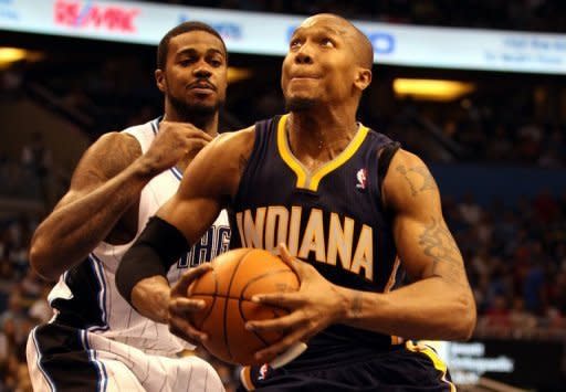 David West of the Indiana Pacers drives against Earl Clark of the Orlando Magic in game four of the Eastern Conference quarter-finals in the 2012 NBA Playoffs at Amway Center in Orlando, Florida. The Indiana Pacers squandered a big fourth-quarter lead but held on for a 101-99 over-time win over the Orlando Magic