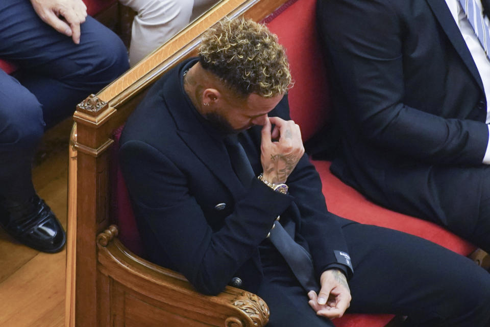 Former FC Barcelona player Neymar who now plays for Paris Saint-Germain sits in court in Barcelona, Spain, Monday Oct. 17, 2022. Neymar is in court to face a trial over alleged irregularities involving his transfer to Barcelona in 2013. Neymar's parents, former Barcelona president Sandro Rosell and representatives for both the Spanish club and Brazilian team Santos are also in court after a complaint brought by Brazilian investment group DIS regarding the amount of the player's transfer. All defendants have denied wrongdoing. (AP Photo/Joan Mateu Parra)