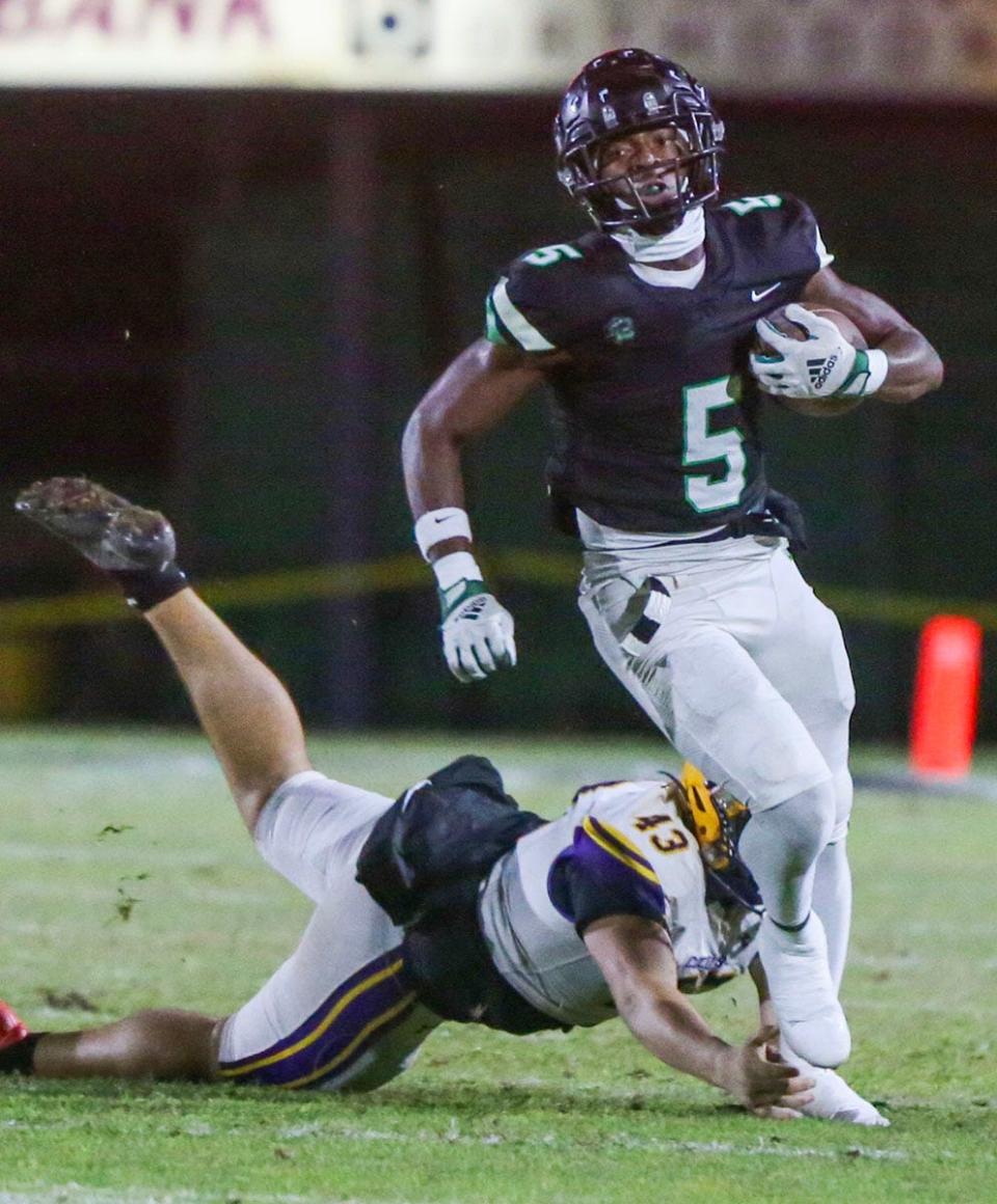 Jonathan Boyd evades a tackle as he nearly takes the opening kickoff for a touchdown during the Choctaw Columbia regional quarterfinal playoff football game at Choctaw.