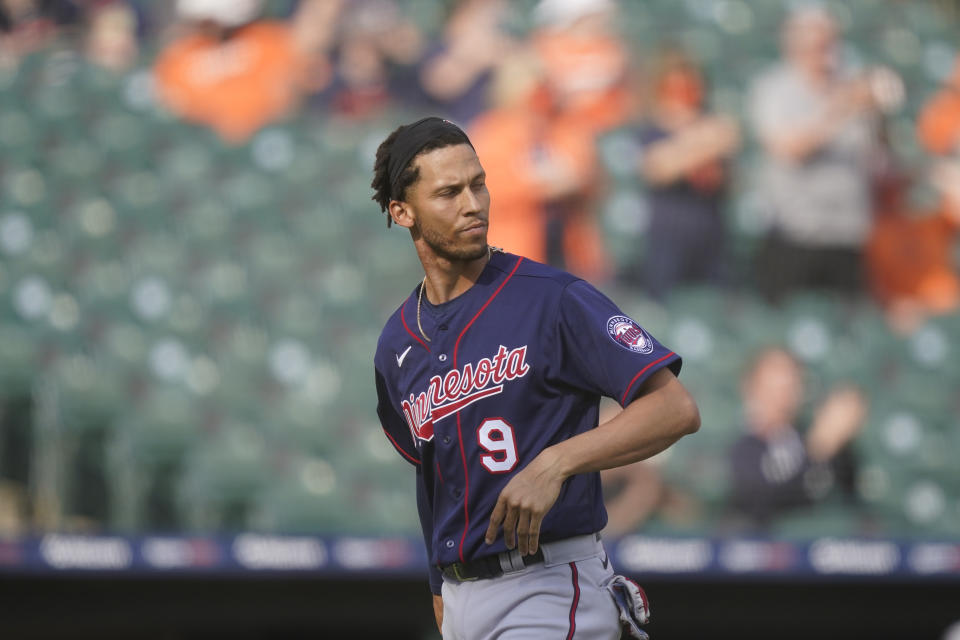 Minnesota Twins' Andrelton Simmons walks back to the dugout after striking out to end the tenth inning of a baseball game against the Detroit Tigers, Tuesday, April 6, 2021, in Detroit. (AP Photo/Carlos Osorio)