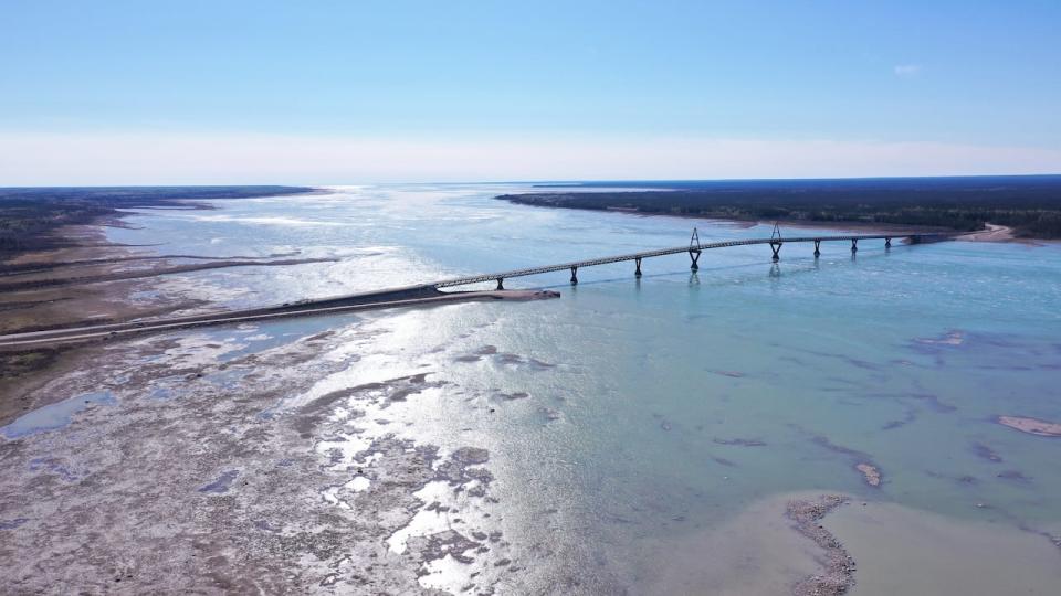 The Deh Cho bridge linking Fort Providence to the N.W.T. highway system. Low levels of water can be seen well into the middle of the Mackenzie River.