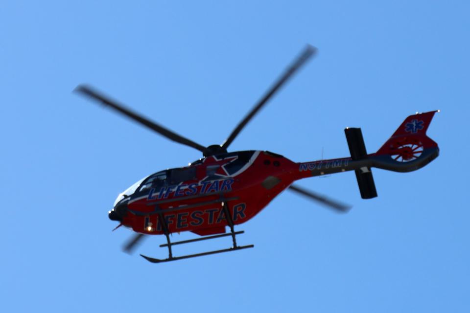 A LifeStar helicopter does a flyover as hundreds gather to honor Fritch Volunteer Fire Chief Zeb Smith, as he was laid to rest just north of Fritch at Westlawn Memorial Park on Saturday afternoon.