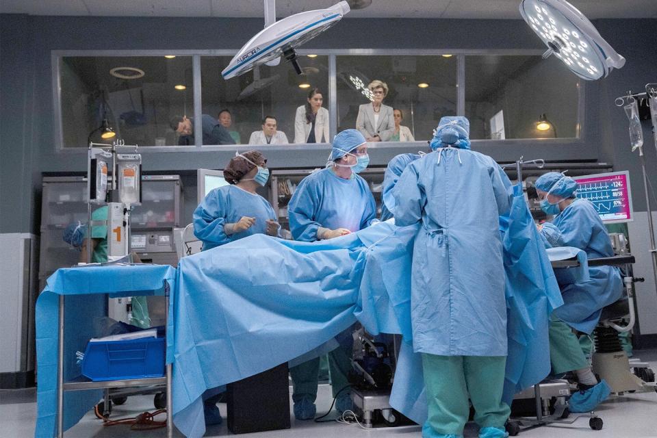 NEW AMSTERDAM -- "How Can I Help" Episode 513 -- Pictured: (l-r) Matthew Jeffers as Resident Mark Walsh, Janet Montgomery as Dr. Lauren Bloom, Debra Monk as Karen Brantley -- (Photo by: Ralph Bavaro/NBC)