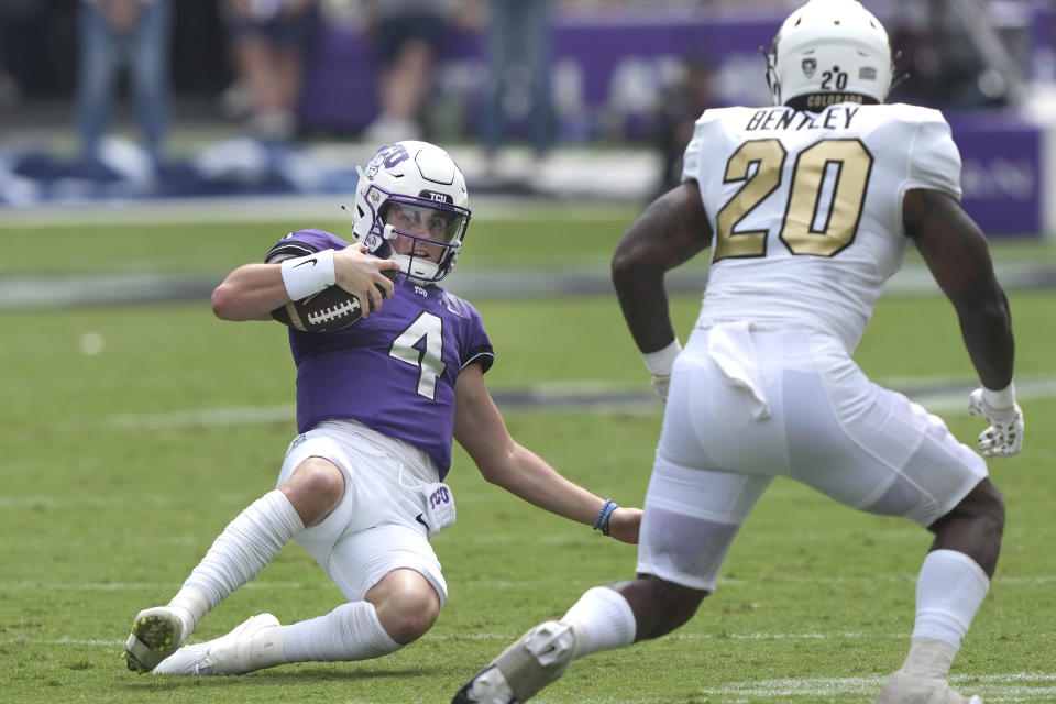 TCU quarterback Chandler Morris (4) slides on a keeper against Colorado linebacker LaVonta Bentley (20) during the first half of an NCAA college football game Saturday, Sept. 2, 2023, in Fort Worth, Texas. (AP Photo/LM Otero)