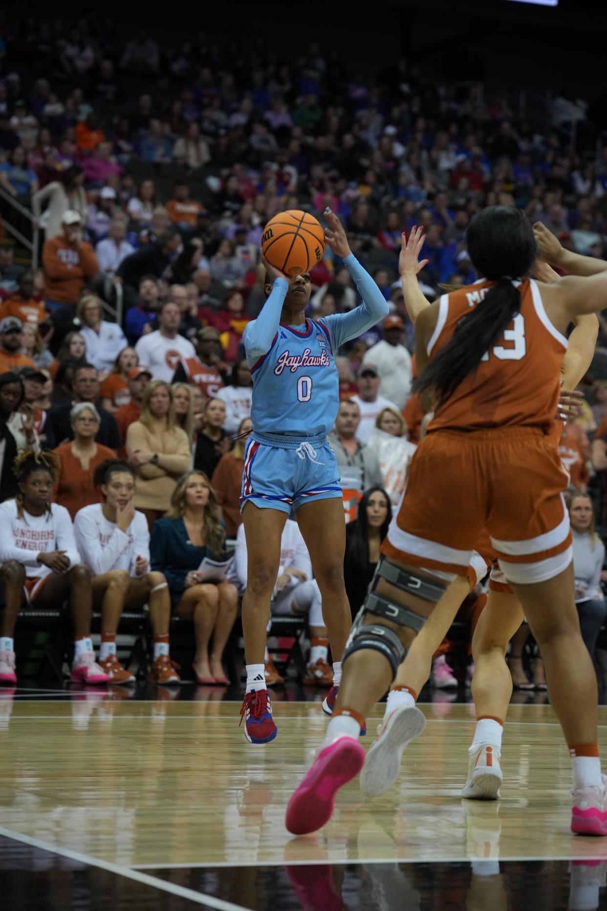 Kansas women's basketball guard Wyvette Mayberry takes a shot against Texas during a 2024 Big 12 Conference tournament game in Kansas City.