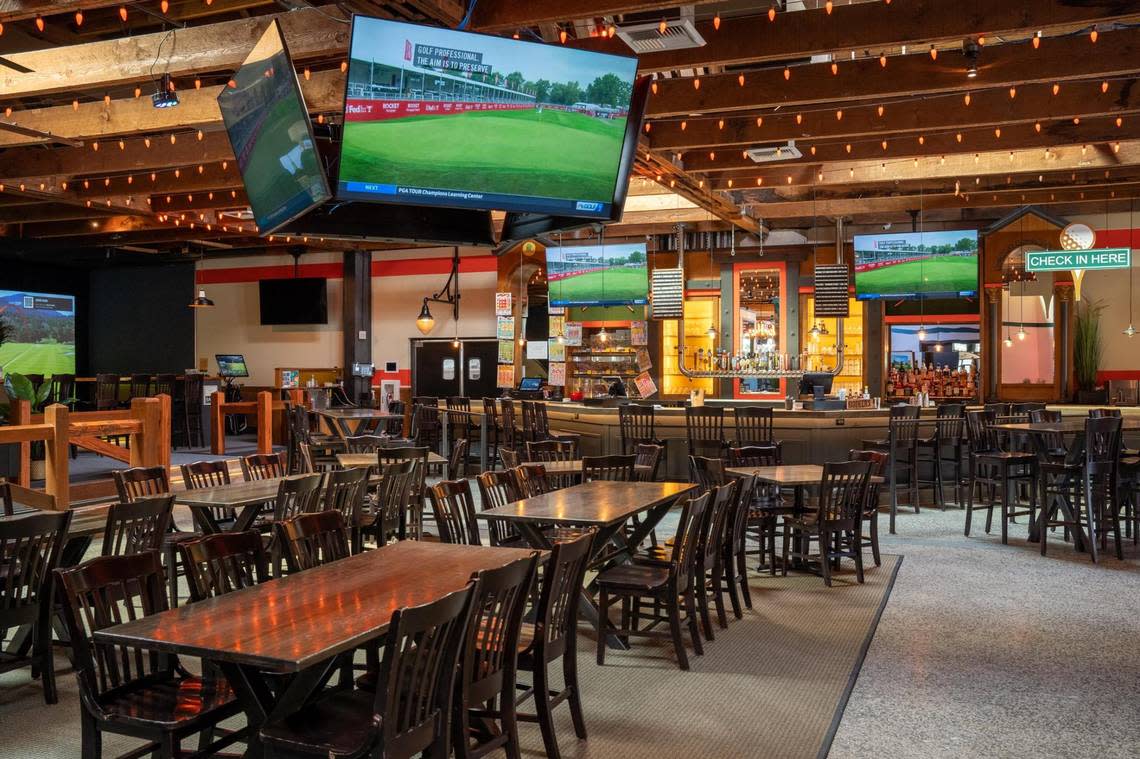 Televisions abound at Stadium Golf, which opened in Tacoma this summer.