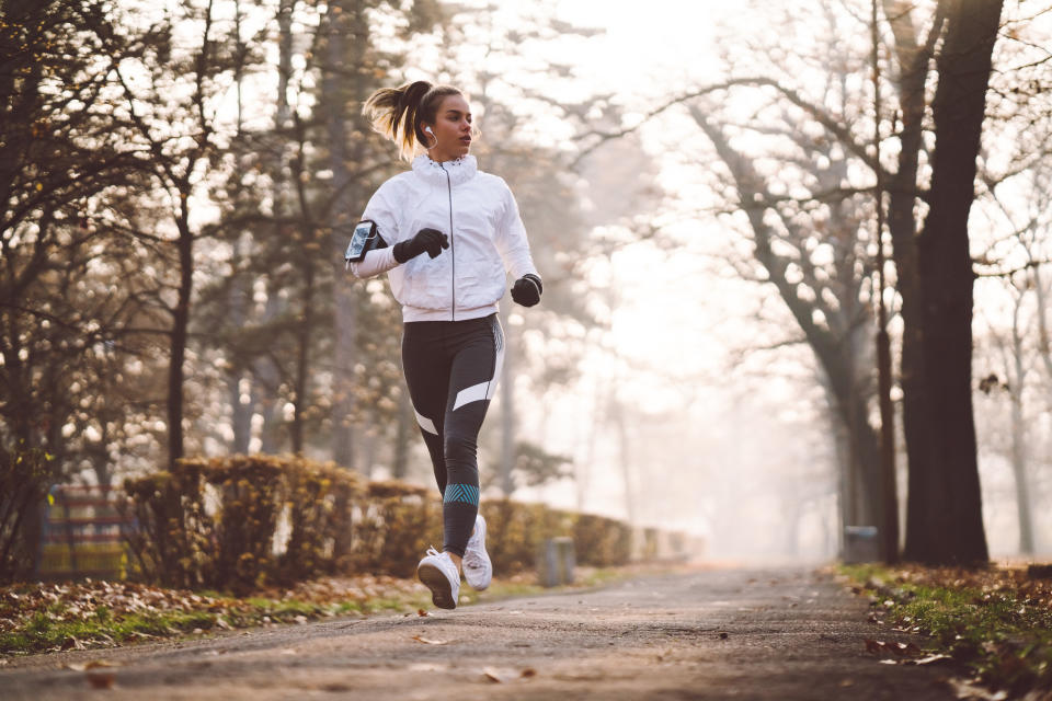 Sports woman exercising among nature in a winter day