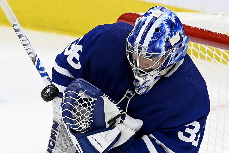 Toronto Maple Leafs goaltender Jack Campbell (36) makes a save during first-period NHL hockey game action against the Edmonton Oilers in Toronto, Saturday, March 27, 2021. (Frank Gunn/The Canadian Press via AP)