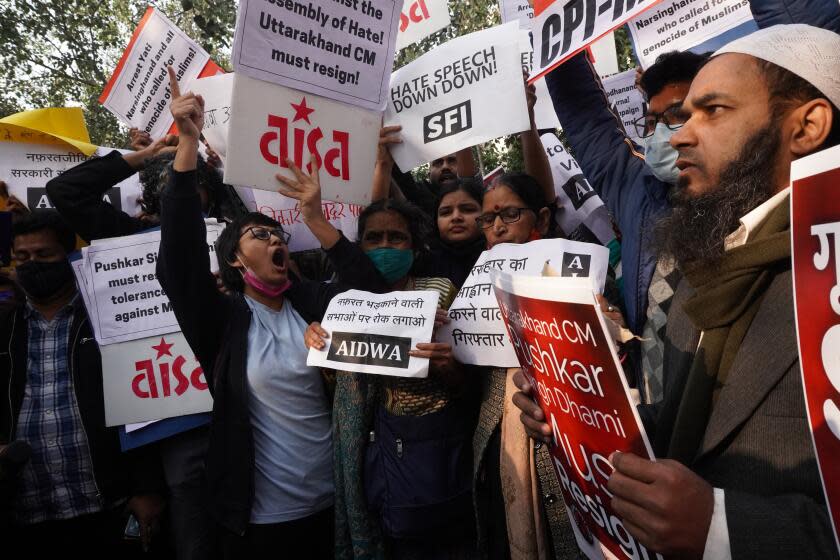 Demonstrators hold placards as they shout slogans during a protest against hate speech event against Muslims at Uttarakhand's Haridwar, in New Delhi, India on December 27, 2021. (Photo by Mayank Makhija/NurPhoto via Getty Images)