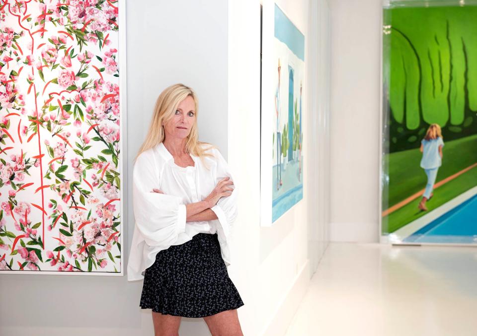 Rachel Lee Hovnanian stands among her works "Cherry Pink Robe," from left, "Cactus Scape," and "Beyond The Hedges," at County Gallery on March 7.