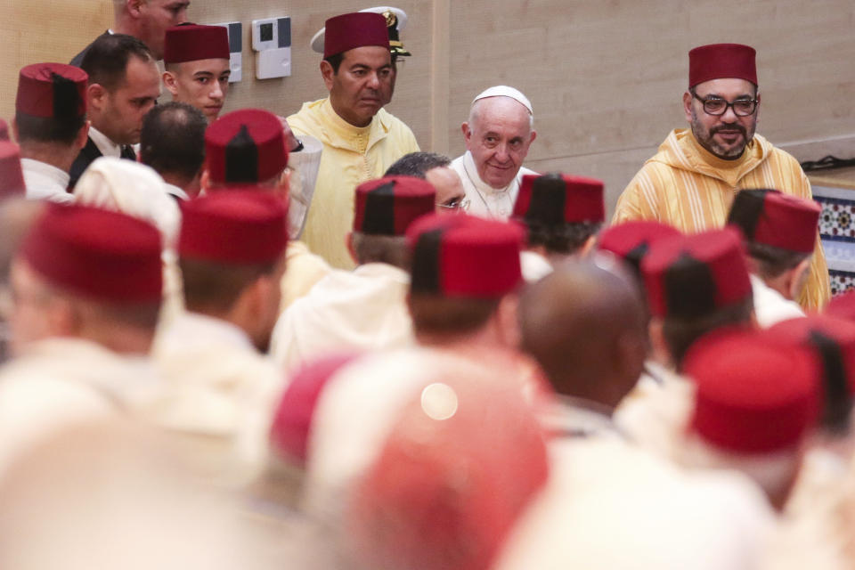 Pope Francis and King Mohamed VI arrive at the Mohammed VI Institute, a school of learning for imams, in Rabat, Morocco, Saturday, March 30, 2019. Francis's weekend trip to Morocco aims to highlight the North African nation's tradition of Christian-Muslim ties while also letting him show solidarity with migrants at Europe's door and tend to a tiny Catholic flock on the peripheries. (AP Photo/Mosa'ab Elshamy)