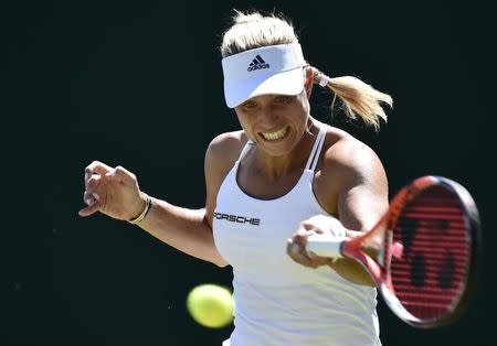 Angelique Kerber of Germany plays a shot during her match against Carina Witthoeft of Germany at the Wimbledon Tennis Championships in London, June 30, 2015. REUTERS/Toby Melville