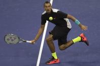 Nick Kyrgios of Australia hits a return to Andy Murray of Britain during their first round match at the U.S. Open Championships tennis tournament in New York, August 31, 2015. REUTERS/Adrees Latif