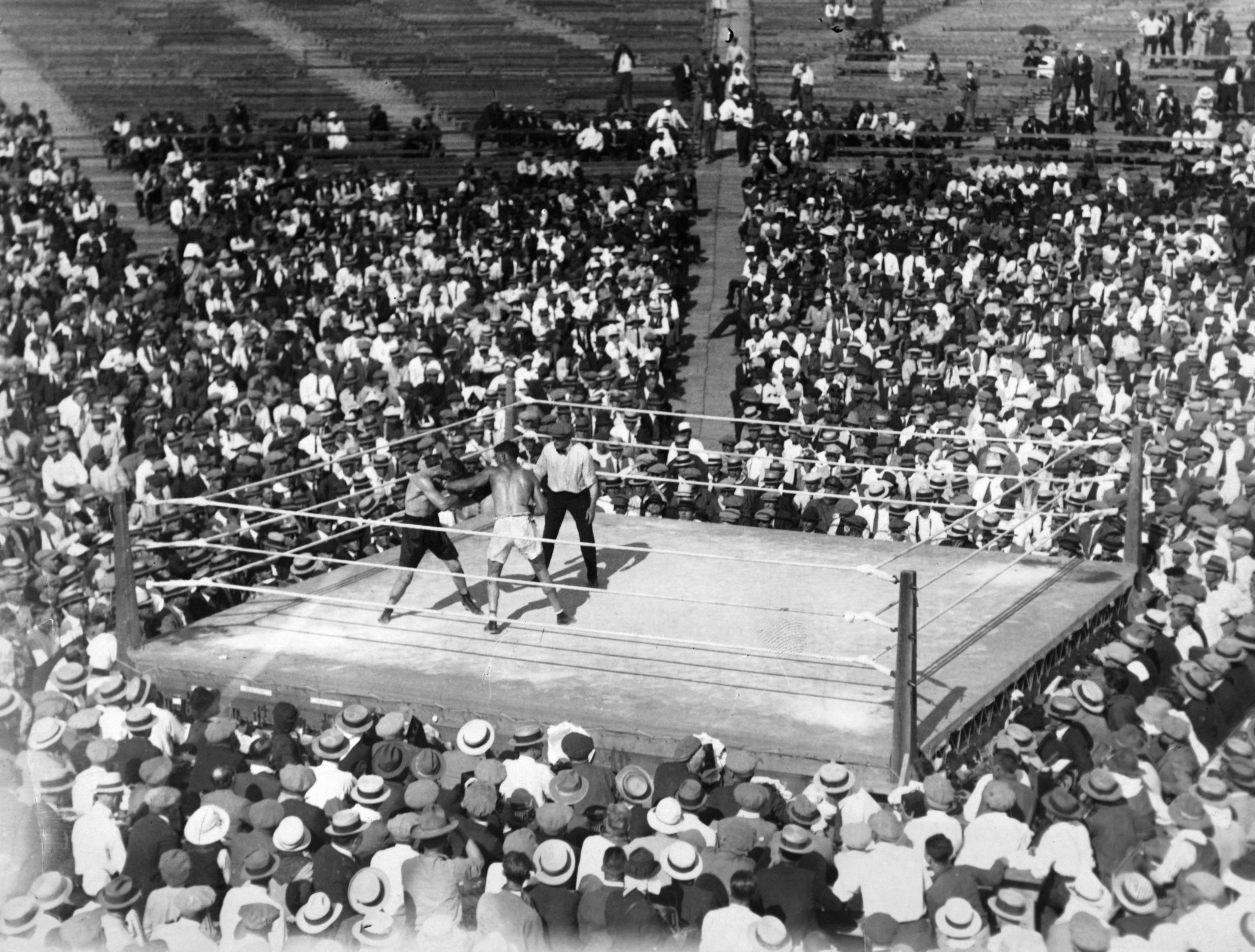 SHELBY,MT - JULY 4,1923: Jack Dempsey (R) connects a left jab to Tommy Gibbons during the fight at the Arena, on July 4,1923 in Shelby, Montana. Jack Dempsey won the World Heavyweight Title by a PTS 15.
(Photo by: The Ring Magazine via Getty Images) 