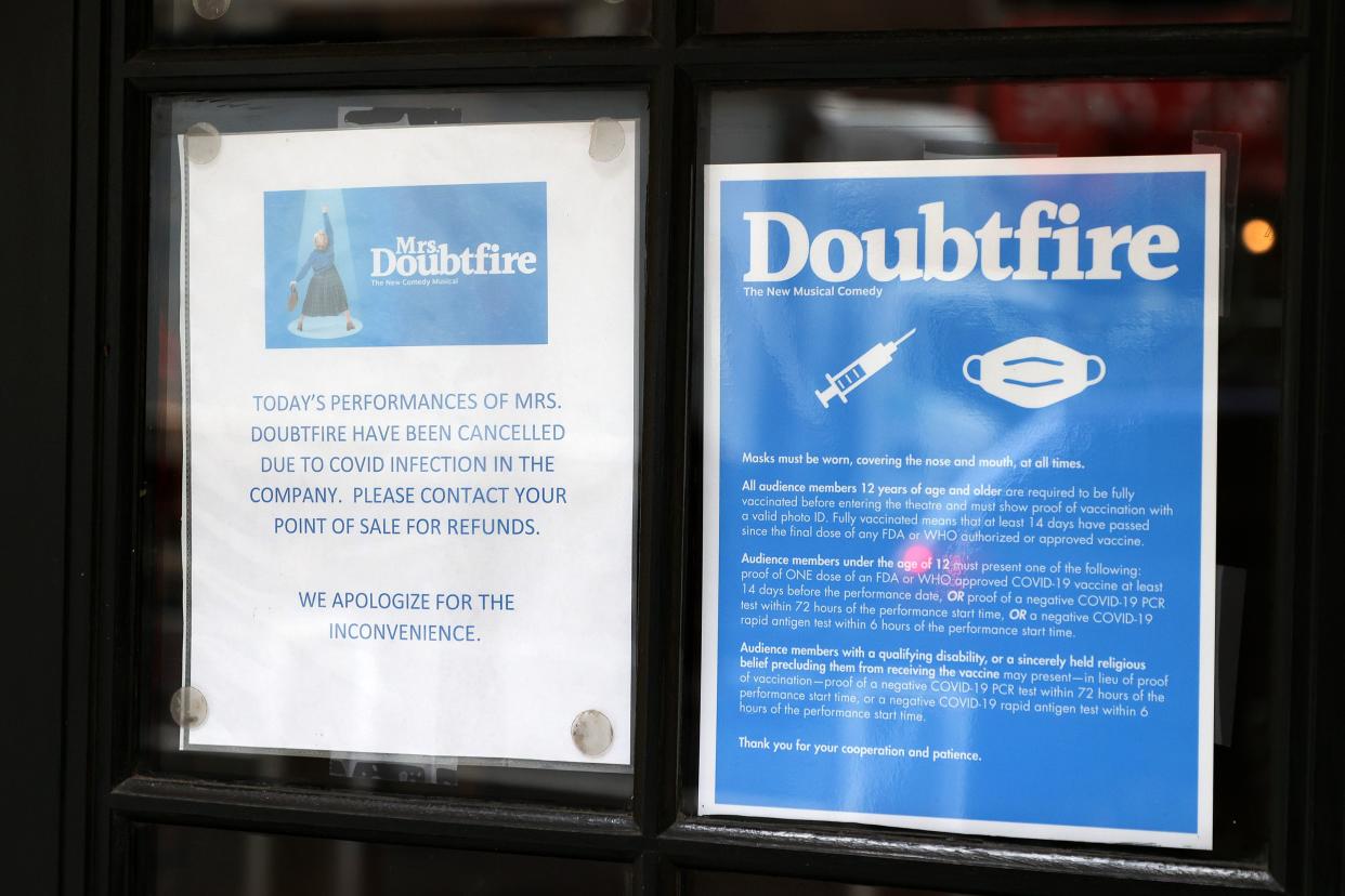 A sign indicating canceled performances of "Mrs. Doubtfire" due to COVID is displayed in the window of the Stephen Sondheim Theatre on Dec. 16. 