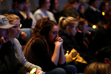 Mourners are seen at a vigil for families of victims of a mass shooting in Thousand Oaks, California, U.S. November 8, 2018. REUTERS/Eric Thayer