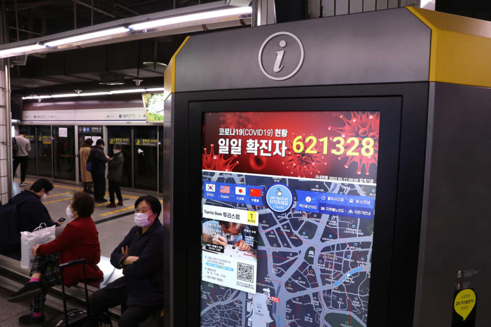 <div class="inline-image__caption"><p>A screen shows the number of new COVID-19 infections nationwide at a subway station on March 17, 2022, in Seoul, South Korea.</p></div> <div class="inline-image__credit">Chung Sung-Jun/Getty</div>