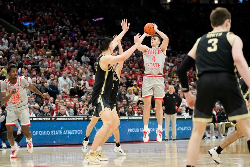 Jan 5, 2023; Columbus, OH, USA;  Ohio State Buckeyes guard Sean McNeil (4) hits a three pointer late in the second half of the NCAA men's basketball game against the Purdue Boilermakers at Value City Arena. Purdue won 71-69. Mandatory Credit: Adam Cairns-The Columbus Dispatch