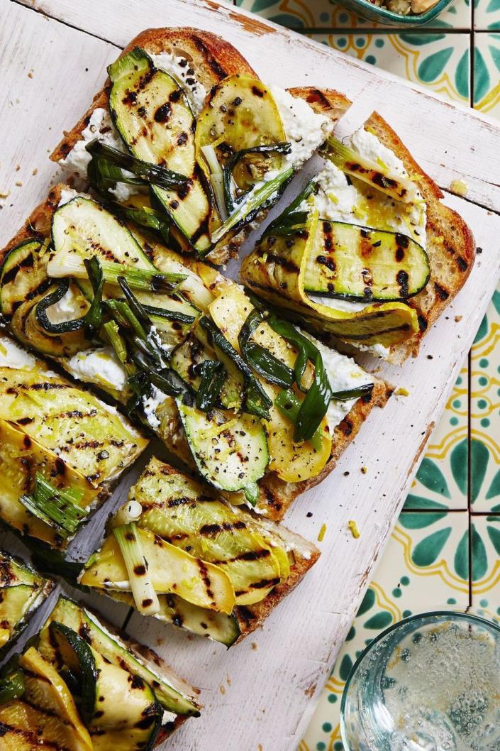 <p>If you're craving hearty pizza, satisfy your tastebuds with this fresh veggie version.</p><p><a href="https://www.womansday.com/food-recipes/food-drinks/a22469348/grilled-squash-garlic-bread-recipe/" rel="nofollow noopener" target="_blank" data-ylk="slk:Get the Grilled Squash Garlic Bread recipe." class="link "><em><strong>Get the Grilled Squash Garlic Bread recipe.</strong></em></a> </p>