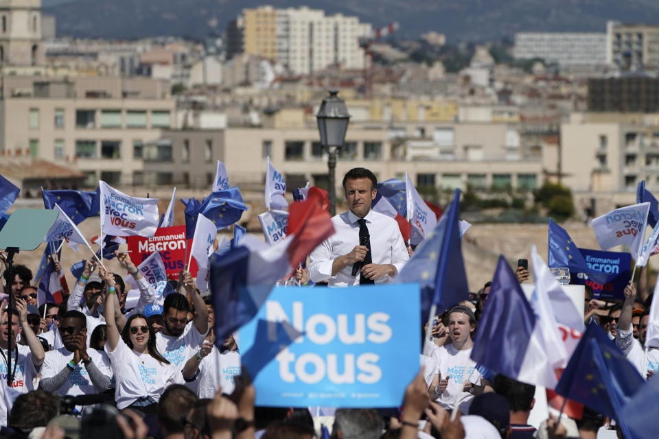 French President and centrist candidate Emmanuel Macron speaks during a campaign rally, Saturday, April 16, 2022 in Marseille, southern France. Far-right leader Marine Le Pen is trying to unseat centrist President Emmanuel Macron, who has a slim lead in polls ahead of France's April 24 presidential runoff election. (AP Photo/Laurent Cipriani)
