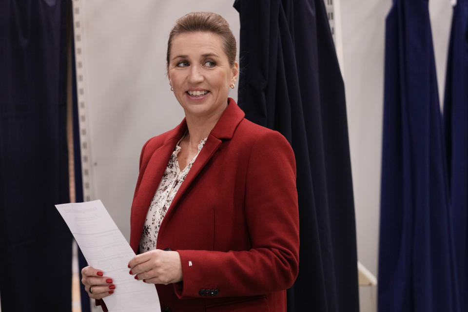 Danish Prime Minister Mette Frederiksen smiles before casting at a polling station in Hareskovhallen in Vaerloese, Denmark, on Tuesday, Nov 1, 2022. Denmark's election on Tuesday is expected to change its political landscape, with new parties hoping to enter parliament and others seeing their support dwindle. A former prime minister who left his party to create a new one this year could end up as a kingmaker, with his votes being needed to form a new government. (AP Photo/Sergei Grits)