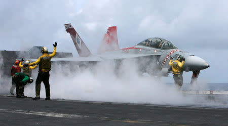 FILE PHOTO: A U.S. naval F/A-18 Super Hornet aircraft takes off from the USS Kitty Hawk aircraft carrier during wargames between navies of India, Japan, Australia and Singapore in the Bay of Bengal September 7, 2007. REUTERS/Adnan Abidi/File Photo