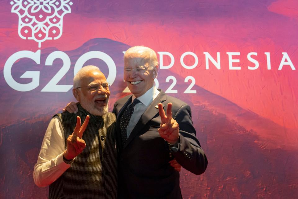 President Joe Biden (R) gestures with India's Prime Minister Narendra Modi before the Partnership for Global Infrastructure and Investment meeting at the G20 Summit in Nusa Dua on the Indonesian resort island of Bali on November 15, 2022.