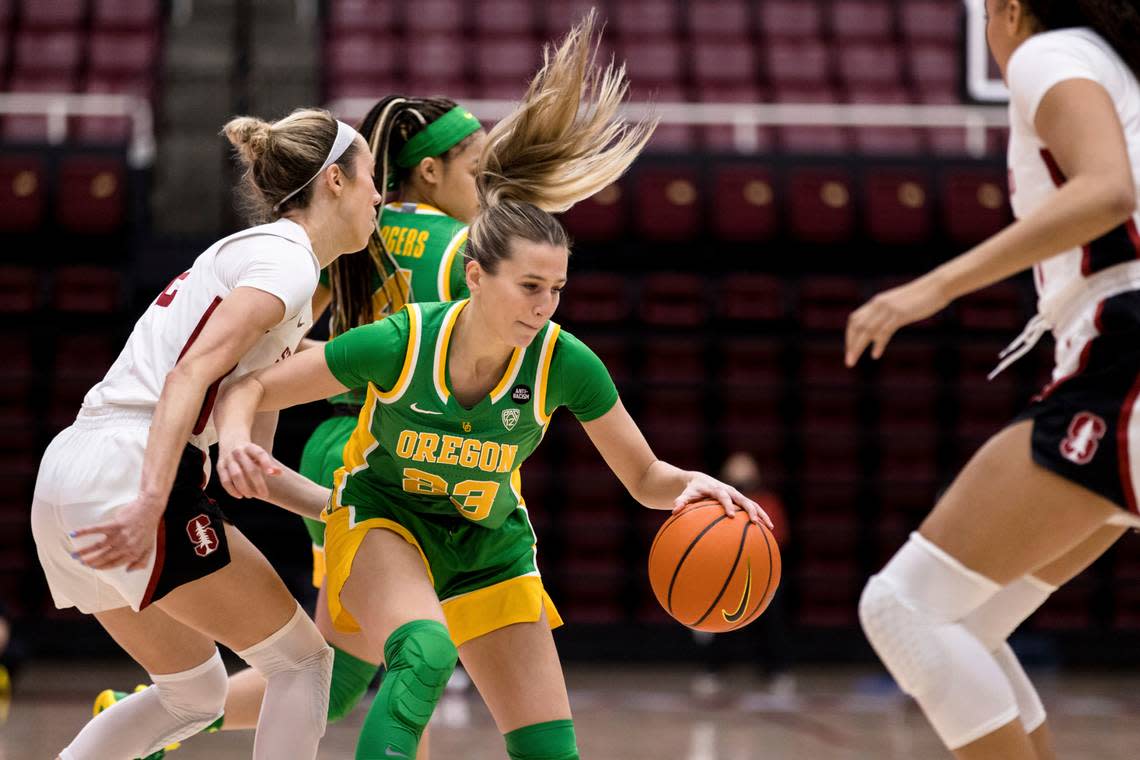 Oregon guard Maddie Scherr (23) dribbles as Stanford guard Lexie Hull, left, defends during the first half of an NCAA college basketball game Friday, Jan. 7, 2022, in Stanford, Calif. (AP Photo/John Hefti) Scherr, a former Kentucky Miss Basketball winner, has joined Kentucky as a transfer.