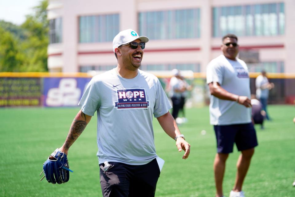 New York Yankees pitcher Nestor Cortes, left, and bullpen coach Mike Harkey participate in the skills clinic during their celebration of "Hope week" for the Paterson Divas and Silk City Bombers at Hinchliffe Stadium on Wednesday, July 5, 2023, in Paterson.