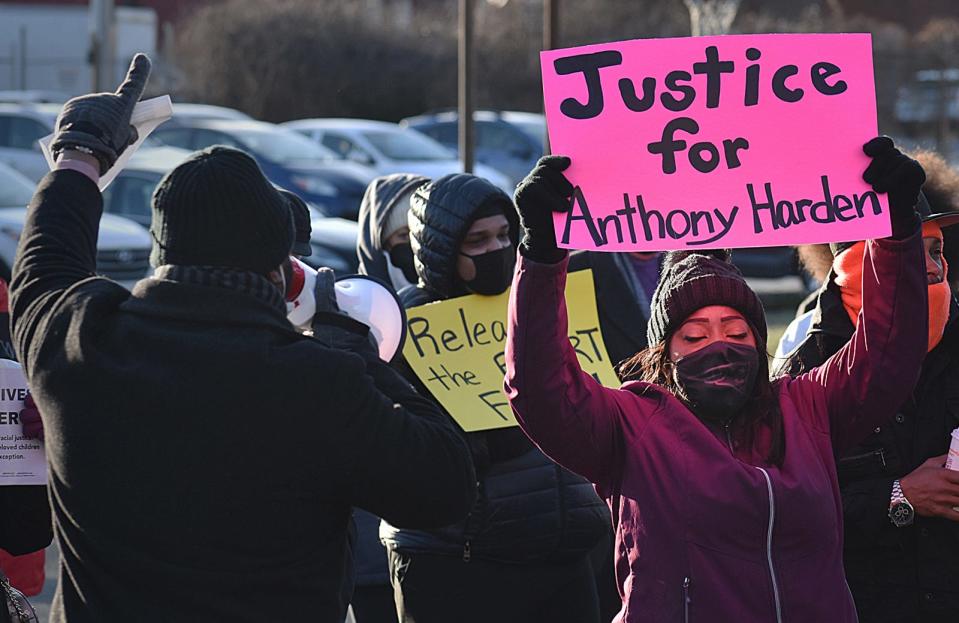 A person holds a sign at a rally in Fall River's Britland Park held last month to demand police transparency in the fatal police shooting of Anthony Harden.