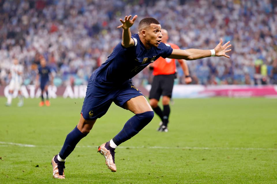 France forward Kylian Mbappe celebrates after scoring his second goal of the match against Argentina during the second half of the 2022 World Cup final at Lusail Stadium. 