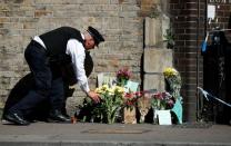 Floral tributes were left at the site where a vehicle was driven into Muslims worshippers near the Finsbury Park mosque in north London, on June 19, 2017