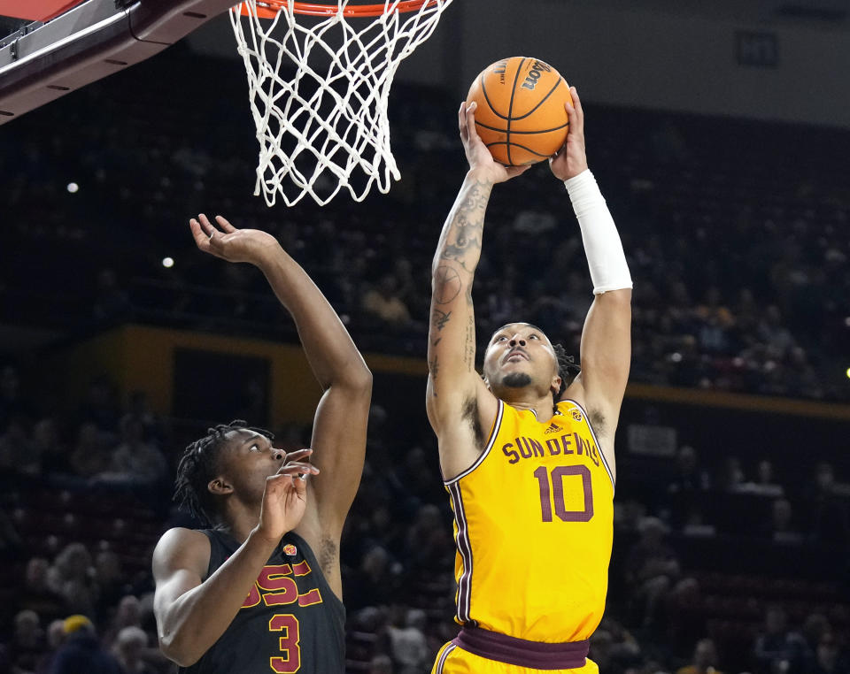 FILE - Arizona State guard Frankie Collins (10) goes up to shoot against Southern California forward Vincent Iwuchukwu (3) during the second half of an NCAA college basketball game in Tempe, Ariz., Jan. 21, 2023. (AP Photo/Ross D. Franklin, File)