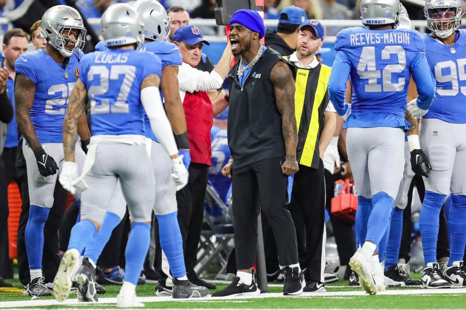 Detroit Lions safety C.J. Gardner-Johnson (2) celebrates a play against Green Bay Packers on the sideline during the second half at Ford Field in Detroit on Thursday, Nov. 23, 2023.
