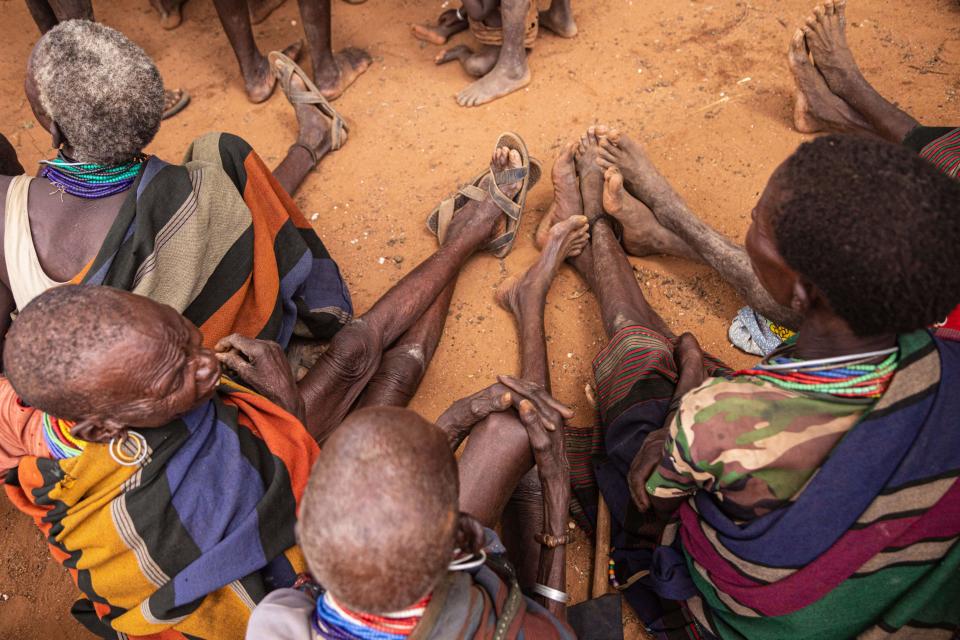 Women attend a village meeting on malnutrition in Uganda in 2022.