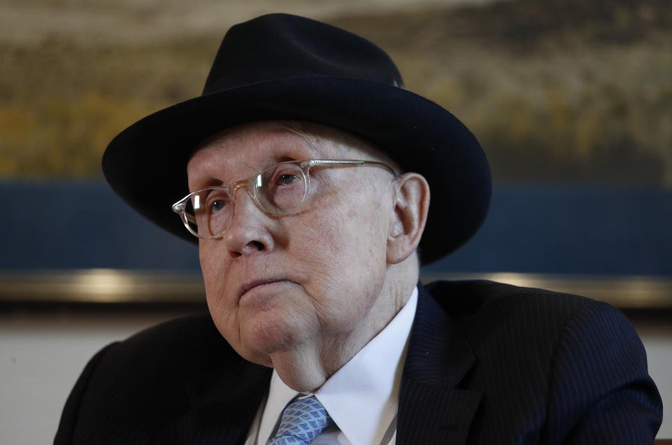 FILE - In this Feb. 19, 2020, file photo former U.S. Sen. Harry Reid listens during an interview in Las Vegas. Reid said if Democrats win the presidency and the Senate, Joe Biden should take “no more than three weeks” to test bipartisanship before ending the filibuster so they can pass bills over Republican obstruction. (AP Photo/John Locher, File)