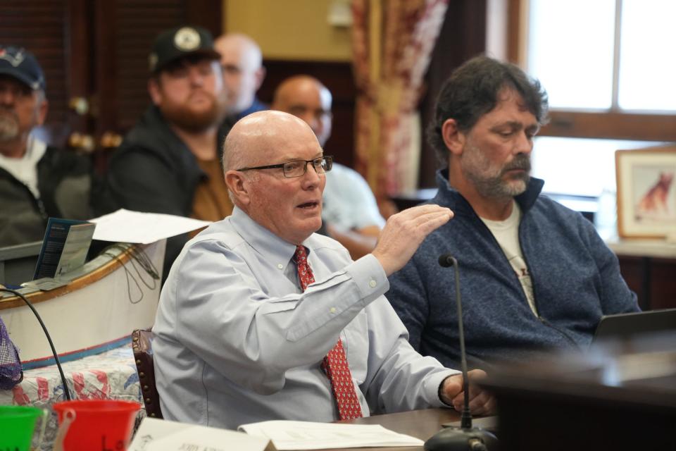 “The data do not lie,” said James Boyd, a longtime official with the state Coastal Resources Management Council who is now serving on the state's quahog commission. Shellfisherman David Ghigliotty is at right.