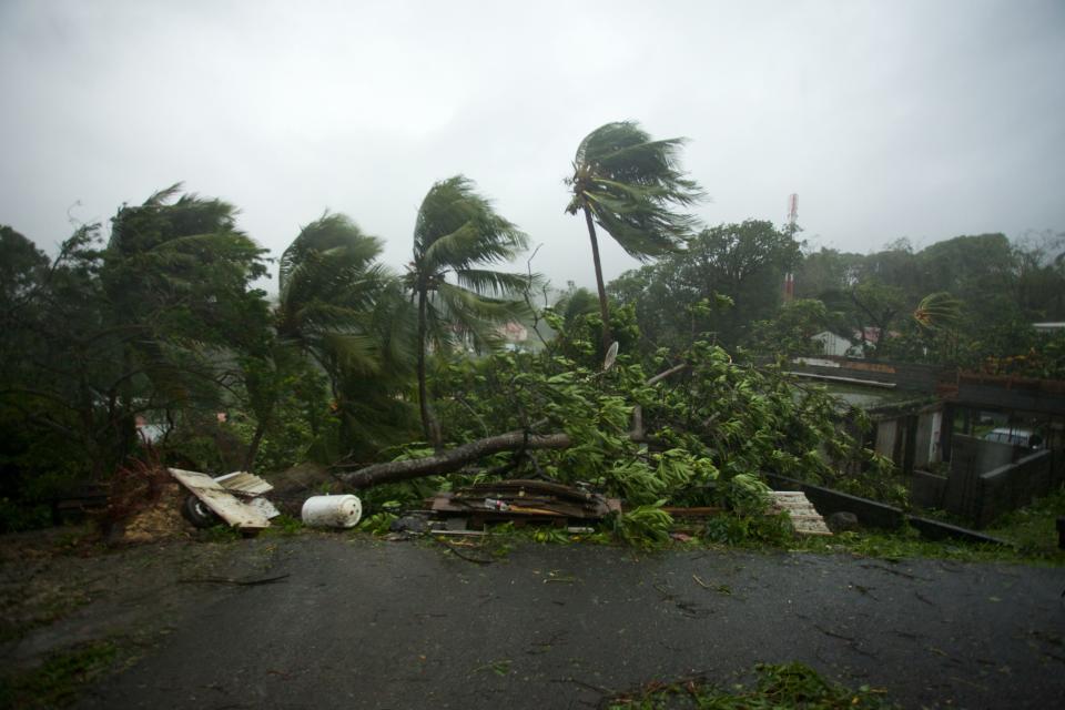 <p>Powerful winds and rains of hurricane Maria battering the city of Petit-Bourg on the French overseas Caribbean island of Guadeloupe on Sept. 19, 2017. (Photo: Cedrik-Isham Calvados/AFP/Getty Images) </p>